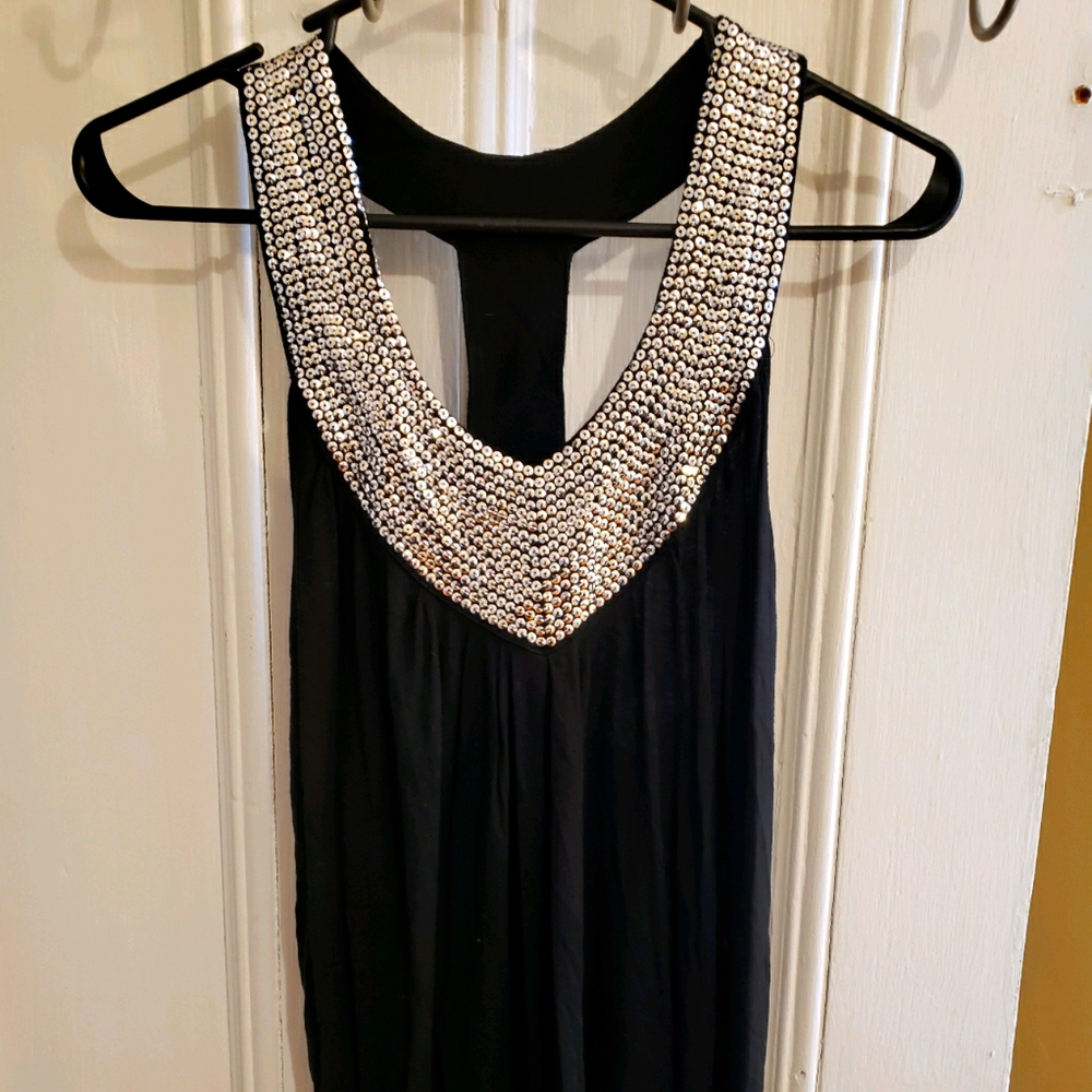 Medium black tank top with gems on the collar
